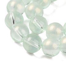 Pyöreähkö lasihelmi läpikuultava hohdepintaväri n. 8 mm vaalea peridootti 25 kpl