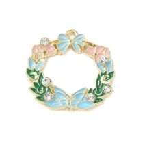 Metalliemalimaskotti kranssi rusetti/ kukat/ perhonen aqua/ kulta /strassit 25x25,5 mm