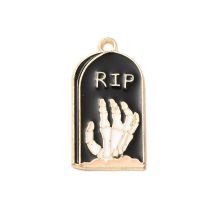 Metalliemalimaskotti hautapaasi "RIP" ja luurankokäsi musta / kulta 27x14 mm