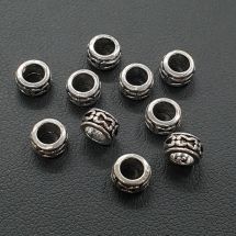 Metallihelmi isoreikäinen kuvioitu rondelli antiikkihopeanvärinen 3,5x7 mm 10 kpl