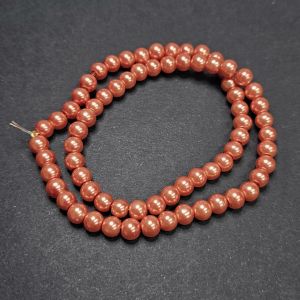 Pyöreä lasihelmi helmiäinen pumpkin 6 mm nauhassa