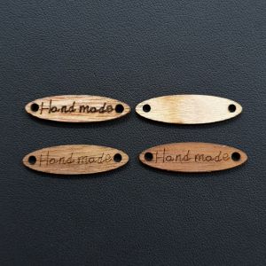 Puuhelmi tagi "Handmade" kapea ovaali n. 27x17,6 mm  ruskea puunvärinen 1 kpl