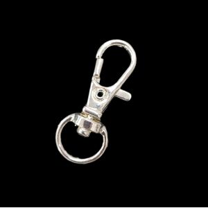 Pieni tukeva pyöriväkantainen papukaija-avaimenperä hopeoitu n. 31x13 mm